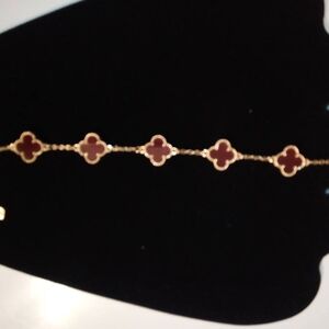 Elegant Gold and Red Clover Bracelet